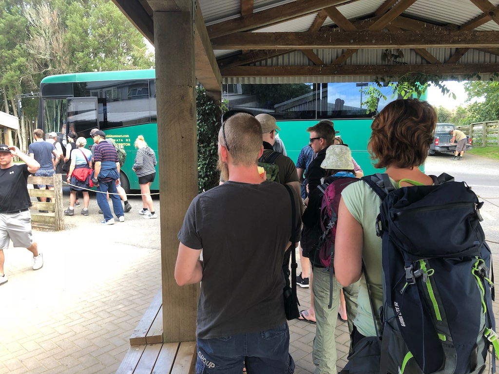 Group getting on bus at Hobbiton Movie Set Tour